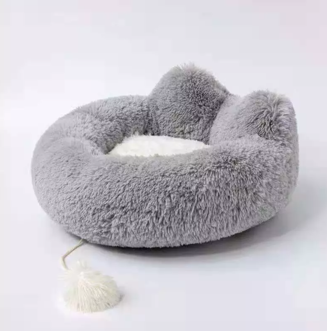 Introducing the Cozy Plush Pet Bed, the ultimate nap spot for your furry friend! This ultra-soft and snuggly bed is designed for pets of all shapes and sizes, offering superior comfort and coziness. With its plush fabric and adorable design, your pet will love curling up for a restful snooze. The non-slip base ensures stability, making it a safe and secure choice for your home. Easy to clean and perfect for pampered pets, this bed is a must-have for keeping your cat or dog cozy and happy.