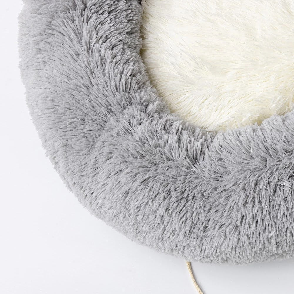 Introducing the Cozy Plush Pet Bed, the ultimate nap spot for your furry friend! This ultra-soft and snuggly bed is designed for pets of all shapes and sizes, offering superior comfort and coziness. With its plush fabric and adorable design, your pet will love curling up for a restful snooze. The non-slip base ensures stability, making it a safe and secure choice for your home. Easy to clean and perfect for pampered pets, this bed is a must-have for keeping your cat or dog cozy and happy.