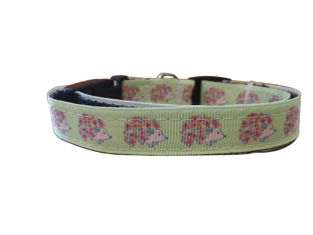 Step up your pup's style with our hedgehog print small dog collar, perfect for the adventurous Corgi or any small breed. Featuring a whimsical hedgehog and floral design on a soft green background, this adjustable collar is both durable and stylish for trips to the beach or everyday walks.