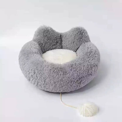 Introducing the Cozy Plush Pet Bed, the ultimate nap spot for your furry friend! This ultra-soft and snuggly bed is designed for pets of all shapes and sizes, offering superior comfort and coziness. With its plush fabric and adorable design, your pet will love curling up for a restful snooze. The non-slip base ensures stability, making it a safe and secure choice for your home. Easy to clean and perfect for pampered pets, this bed is a must-have for keeping your cat or dog cozy and happy.