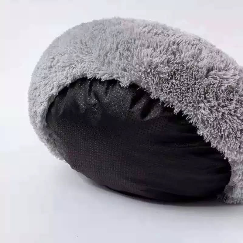 Introducing the Cozy Plush Pet Bed, the ultimate nap spot for your furry friend! This ultra-soft and snuggly bed is designed for pets of all shapes and sizes, offering superior comfort and coziness. With its plush fabric and adorable design, your pet will love curling up for a restful snooze. The non-slip base ensures stability, making it a safe and secure choice for your home. Easy to clean and perfect for pampered pets, this bed is a must-have for keeping your cat or dog cozy and happy.