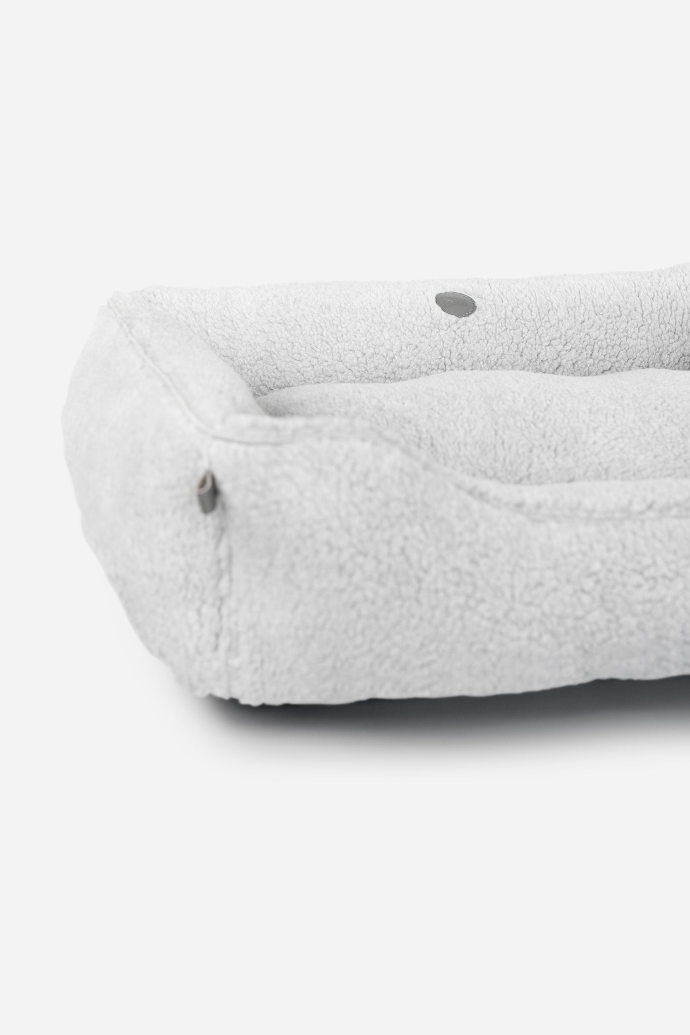 Gray Chester & Lee furry sleeper dog bed with soft, plush material, ideal for small to medium-sized pets.