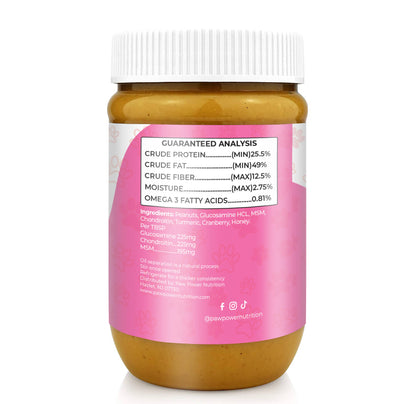 Senior dog with Dawg Butter Berry Flexible joint support peanut butter jar showing cranberry and honey ingredients