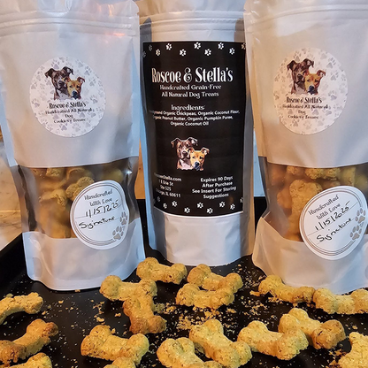 Roscoe & Stella's dog treat packaging with treats on a black surface