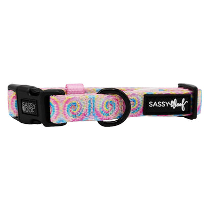 Colorful tie-dye Sassy Woof dog collar with "Good Vibes" print, made for pets, featuring adjustable strap and secure buckle.