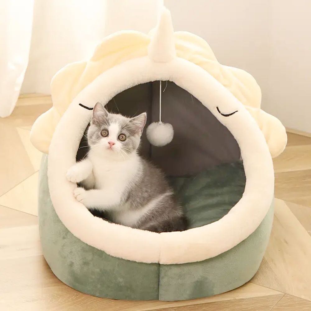 Paws & Pockets dinosaur pet house side view showing hanging plush toy ball, moisture-proof anti-skid base, and breathable PP cotton structure