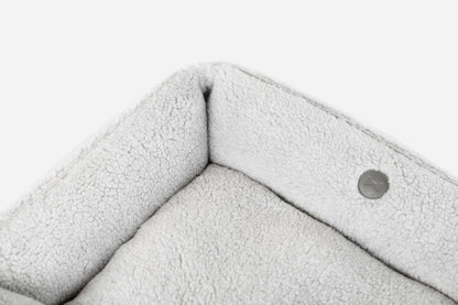 Gray Chester & Lee furry sleeper dog bed with plush interior and soft fabric, designed for comfort and warmth.