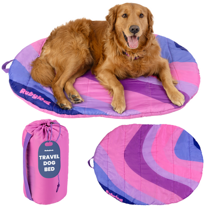 Pink foldable Rubyloo Travel Dog Bed for easy packing, ideal for travel, road trips, and camping with your pet.