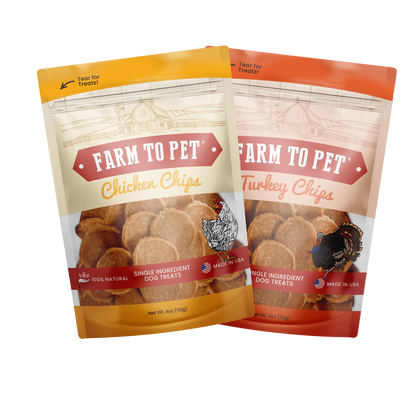 Two stand-up pouches of Farm to Pet dog treats on a plain white background. The front pouch is Chicken Chips with a yellow-orange top and bottom, and the rear pouch is Turkey Chips with an orange top and bottom.