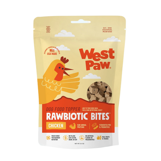 West Paw Rawbiotic Bites dog food topper pouch for chicken flavor, featuring a cartoon chicken illustration on a beige and orange package.