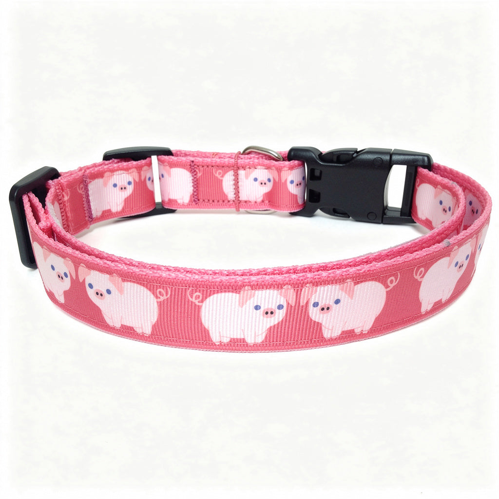 Pink dog collar with sheep pattern on a white background
