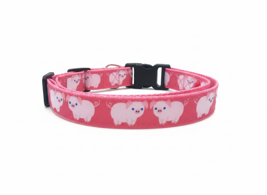 Pink dog collar with white bear pattern on a white background