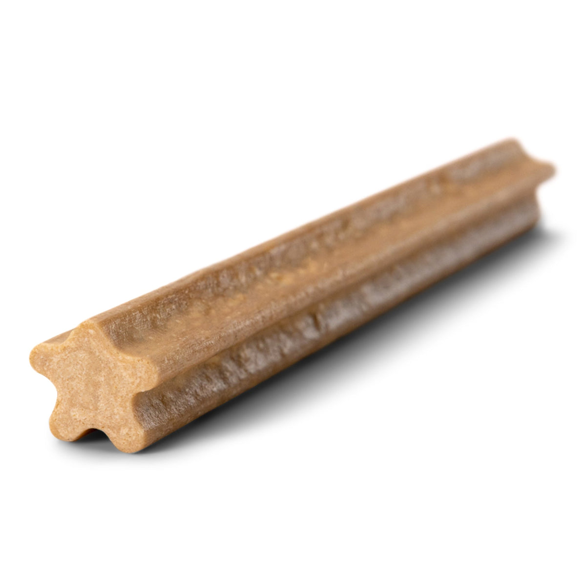 A single West Paw Natural Dental Stick removed from its packaging, showing the ridged texture that helps reduce plaque and tartar