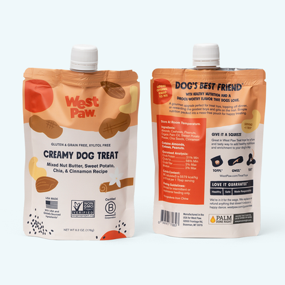 West Paw Nut Butter, Sweet Potato, and Chia Seed treat being squeezed into a dog treat toy