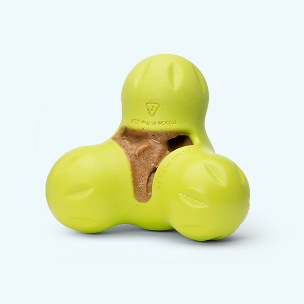 West Paw Peanut Butter and Banana treat being squeezed into a dog treat toy